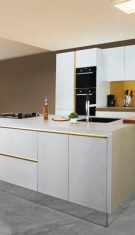Sleek and modern kitchen interior featuring a large island and open shelving in a contemporary setting.